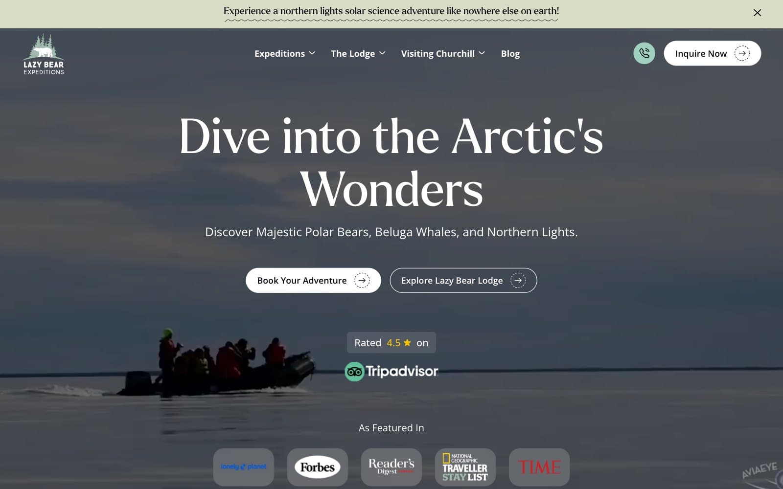 The Lazy Bear Expeditions homepage today. A pale strip across the top reads 'Experience a northern lights solar science adventure like nowhere else on earth!', over a transparent navigation bar carrying the wordmark, Expeditions, The Lodge, Visiting Churchill, Blog and an 'Inquire Now' button. A photograph of a boatload of people in red parkas on flat grey water fills the screen behind the headline 'Dive into the Arctic's Wonders', the line 'Discover Majestic Polar Bears, Beluga Whales, and Northern Lights.', two buttons, a 4.5 Tripadvisor rating and an 'As Featured In' row of five press logos.